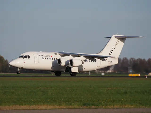 CityJet EI-RJN BAe 146 - Avro RJ takeoff from Polderbaan, Schiphol (AMS - EHAM) at sunset, pic1.