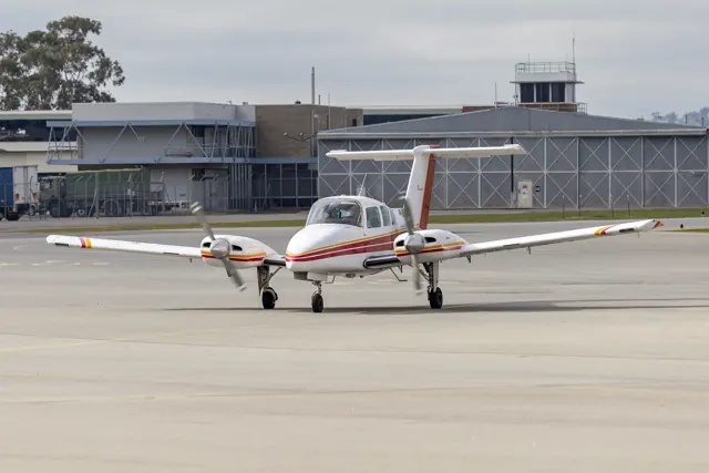 Clamback & Hennessy Flying Training School (VH-WEU) Beechcraft Duchess taxiing at Wagga Wagga Airport.