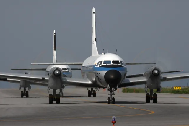 A JASDF YS-11 viewed from the front on the ground.