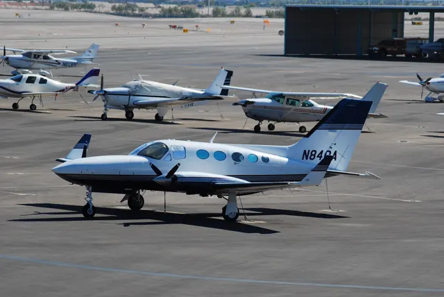 An early Cessna 414 with wingtip fuel tanks on the ramp; the later 414A uses a different wing.