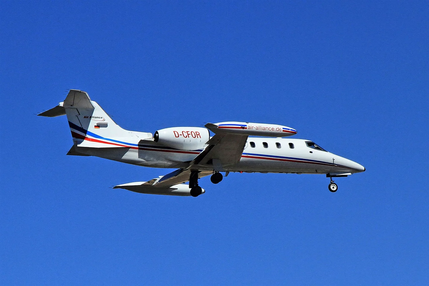 Learjet 35 D-CFOR in flight with the landing gear extended.