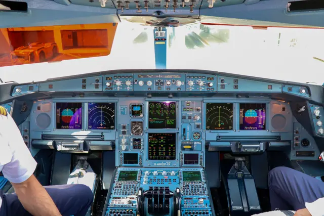 The flight deck of an Lufthansa A340-600, showing updated equipment and flight displays compared to the older A340-200/300 (below)
