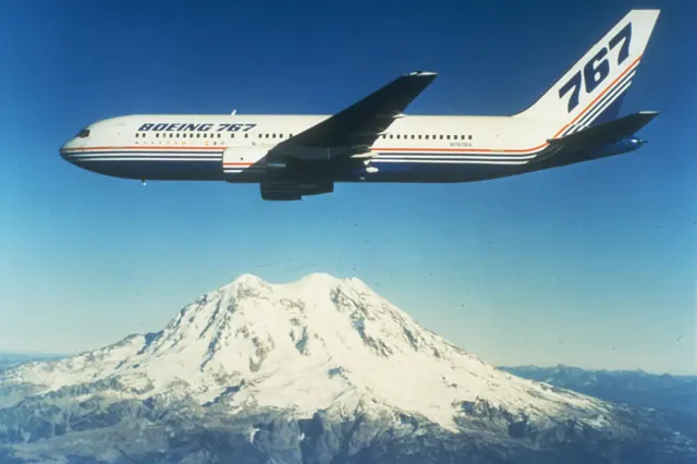 The first 767-200 built, N767BA, in flight near Mount Rainier c. 1982