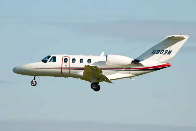 CJ1 side view, four windows, thrust attenuator paddles behind engines