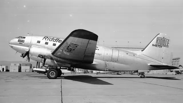 Riddle Airlines at Oakland 1955. Riddle had several dozen C-46s and originated one of the modification packages (C-46R) to bring the aircraft up to scheduled passenger transport standards