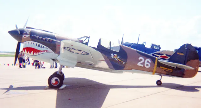 P-40N Warhawk N1226N, restored in the markings of the American Volunteer Group (AVG). Confederate Air Force air show, Greater Southwest International Airport (AKA Amon Carter Field), Tarrant County, Texas, 1969.