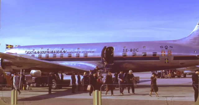 Passengers alighting from an SAS DC-6: Note the upper row of windows, indicating this was built as the optional sleeper variant of the original-length DC-6