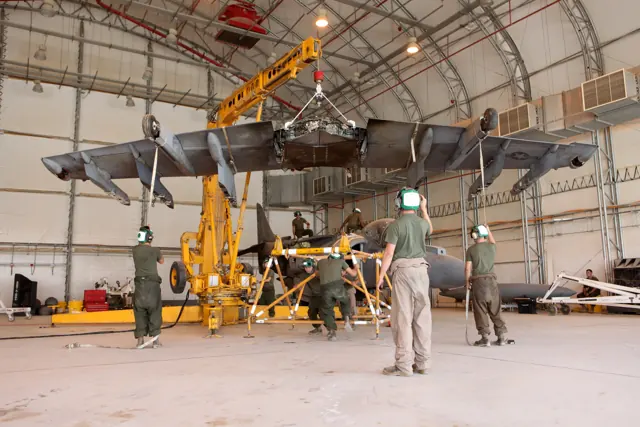 Marines replacing the one-piece supercritical wing of an AV-8B at Camp Bastion , Afghanistan (2012)