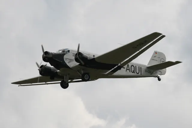 Lufthansa's 21st-century airworthy heritage Ju 52/3mg2e (Wk-Nr 5489) in flight, showing the Doppelflügel , "double wing" trailing-edge control surfaces