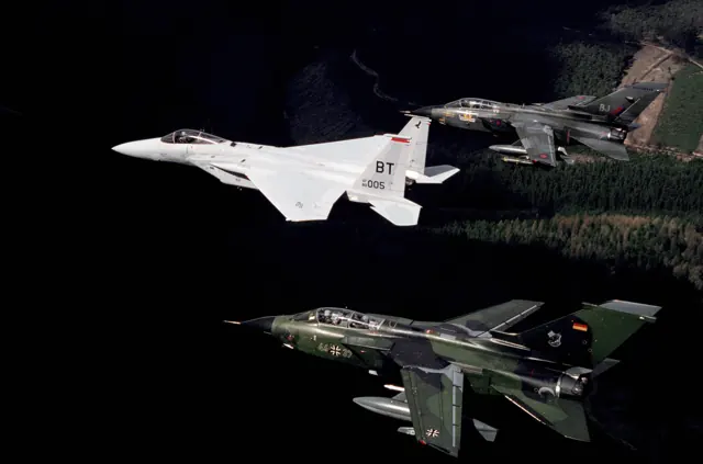 A USAF F-15C flanked by Luftwaffe (bottom) and RAF (top) Tornados in 1987