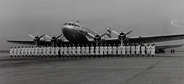 Newly graduated Hostesses lined up in front of Zuni , TWA's Stratoliner NC19907, in early to mid-1940